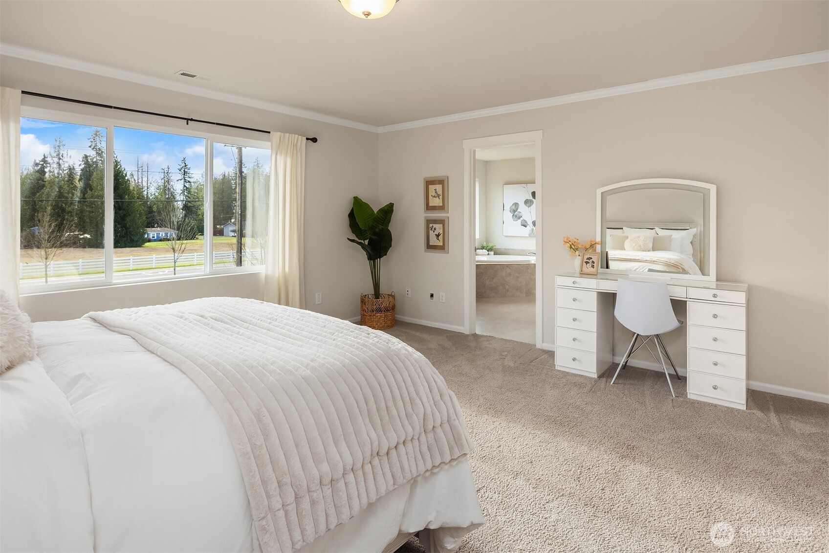 17604 Quartz Street Granite Falls, WA 98252 - Photo 18 of 40 a spacious bedroom with a bed and a large window