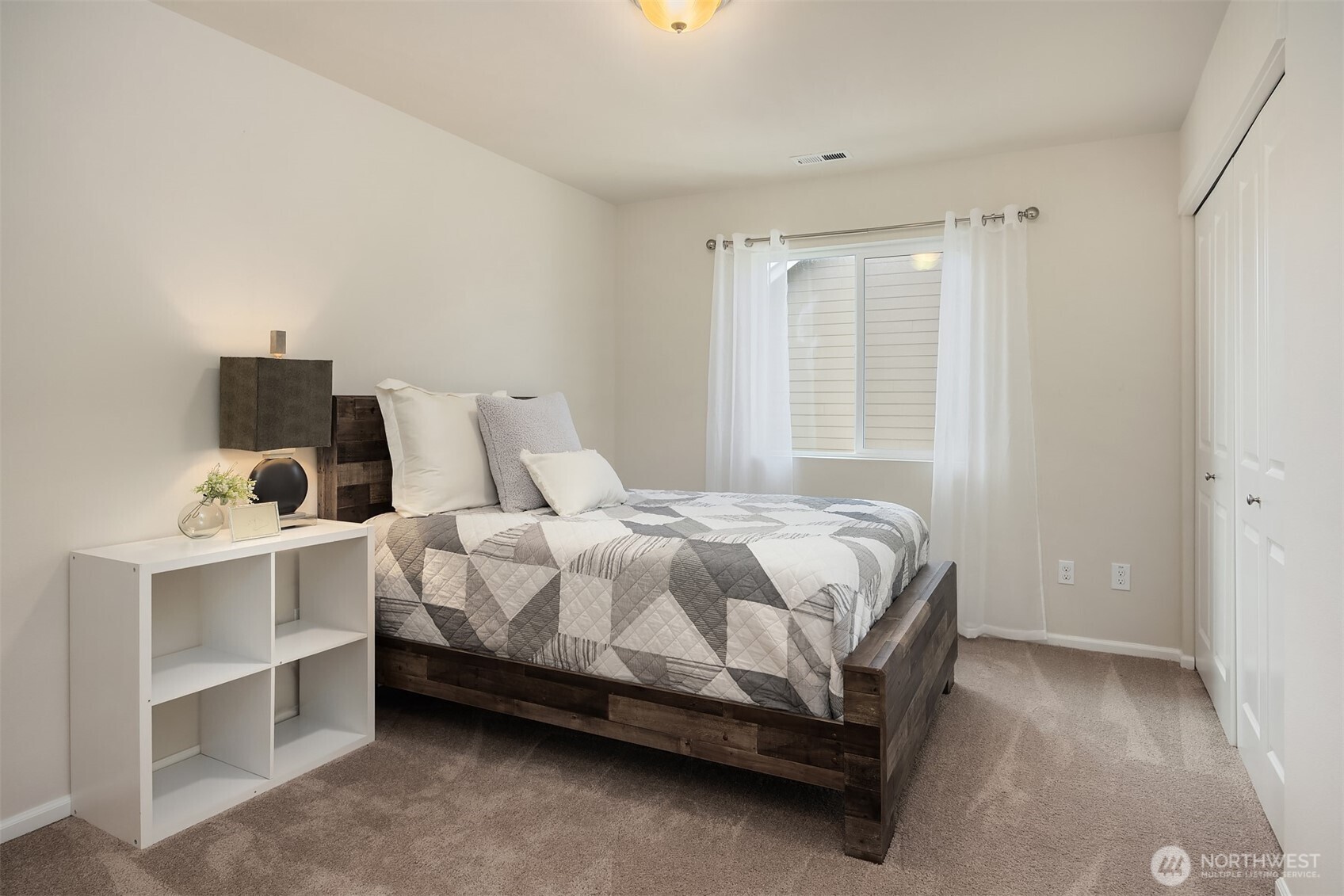 17604 Quartz Street Granite Falls, WA 98252 - Photo 20 of 40 a bed sitting in a bedroom next to a window