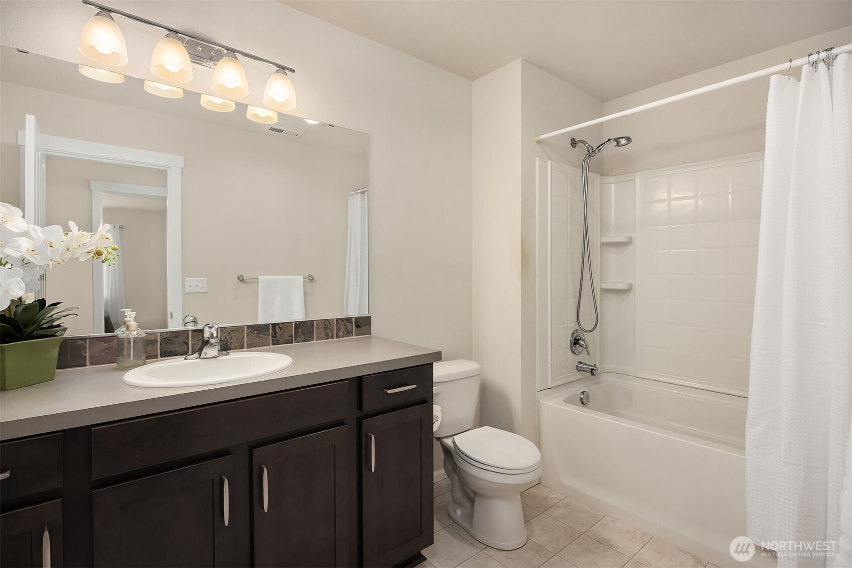 17604 Quartz Street Granite Falls, WA 98252 - Photo 22 of 40 a bathroom with a sink a toilet and shower