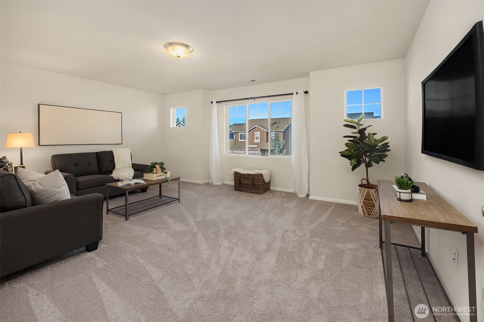 17604 Quartz Street Granite Falls, WA 98252 - Photo 26 of 40 a living room with furniture and a flat screen tv