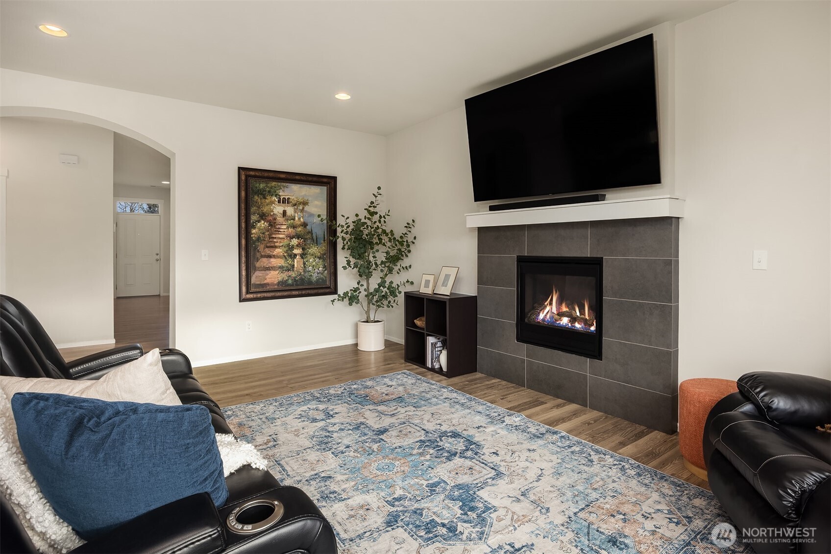 17604 Quartz Street Granite Falls, WA 98252 - Photo 4 of 40 a living room with furniture a flat screen tv and a fireplace