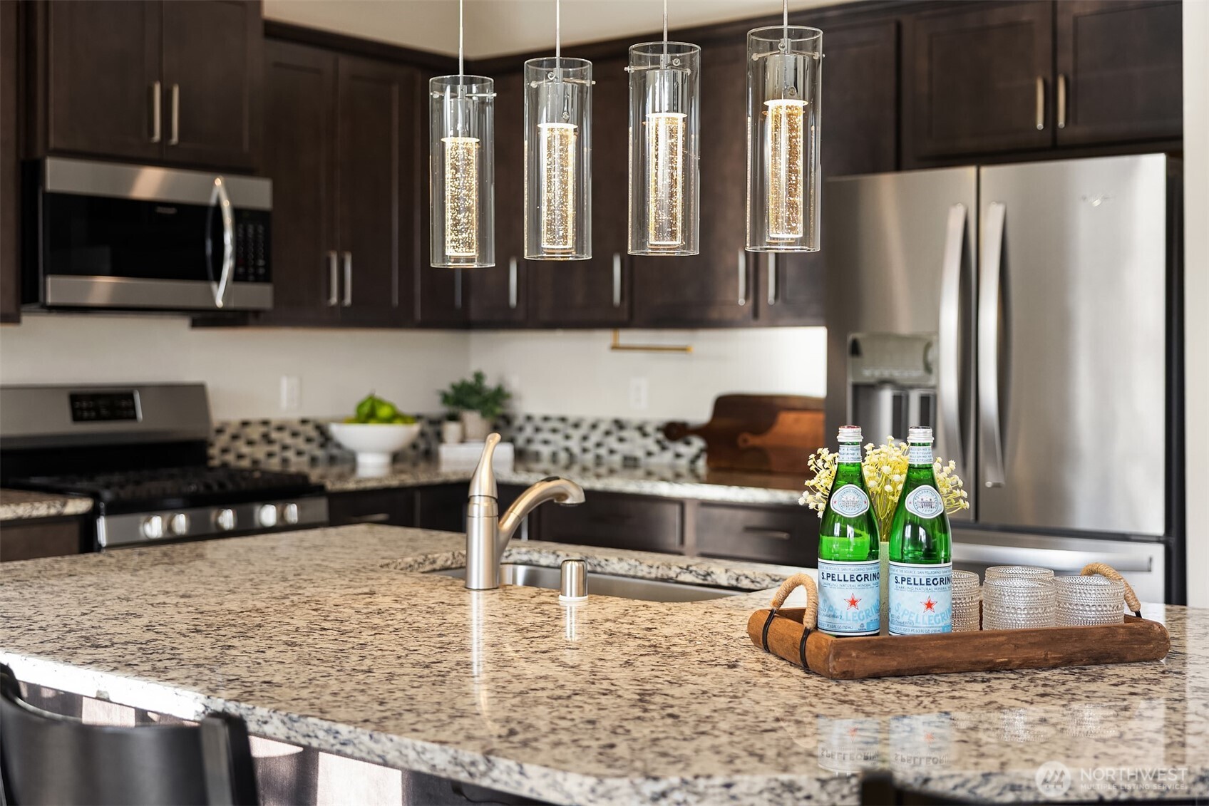 17604 Quartz Street Granite Falls, WA 98252 - Photo 6 of 40 a kitchen with stainless steel appliances granite countertop a refrigerator a stove a sink a counter space and cabinets