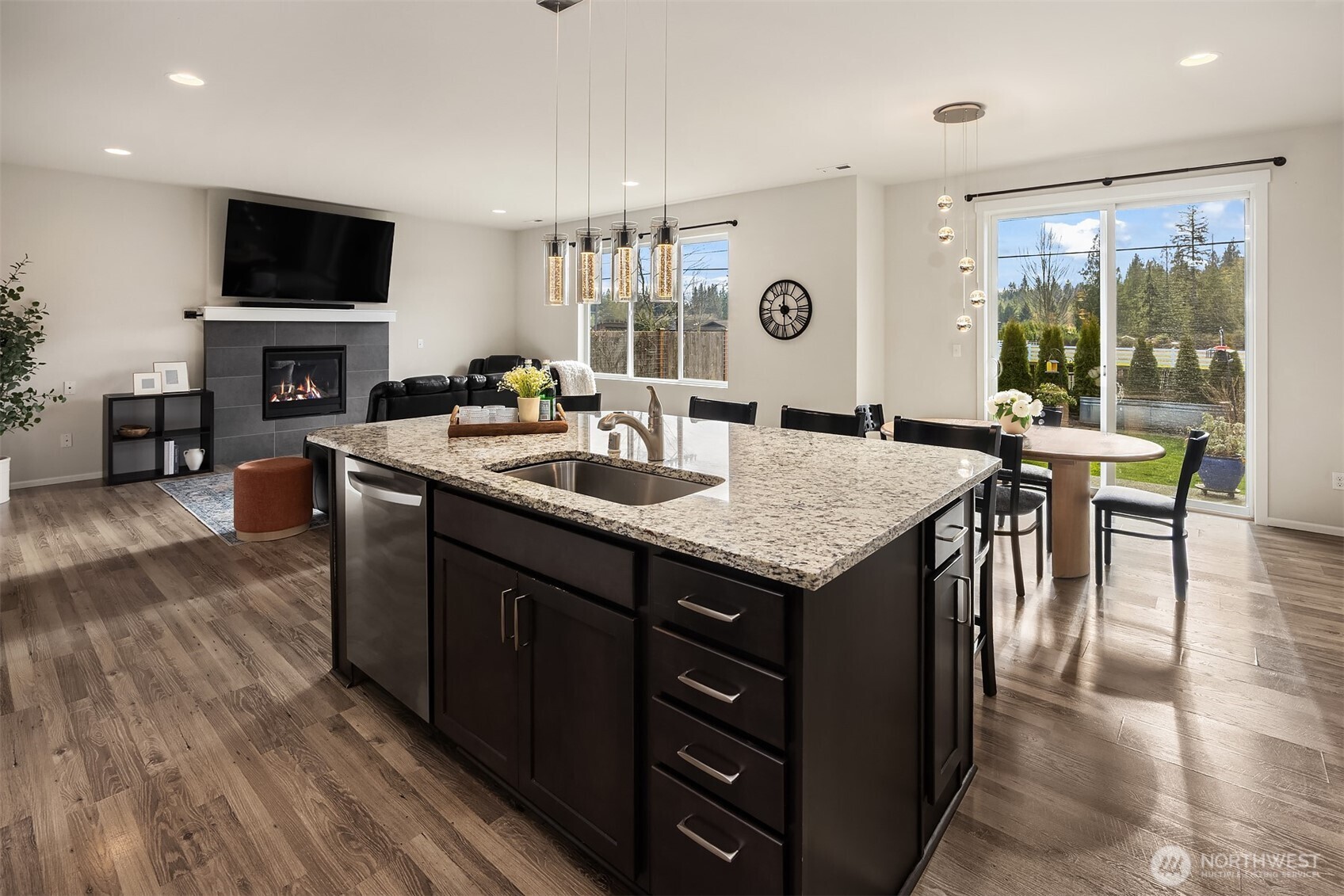 17604 Quartz Street Granite Falls, WA 98252 - Photo 10 of 40 a open kitchen with granite countertop a sink and a wooden cabinets