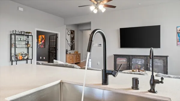 a kitchen with stainless steel appliances granite countertop a stove a microwave and cabinets