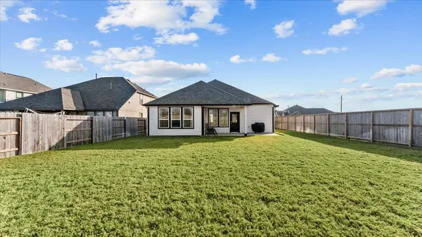 a view of a green field with a big yard