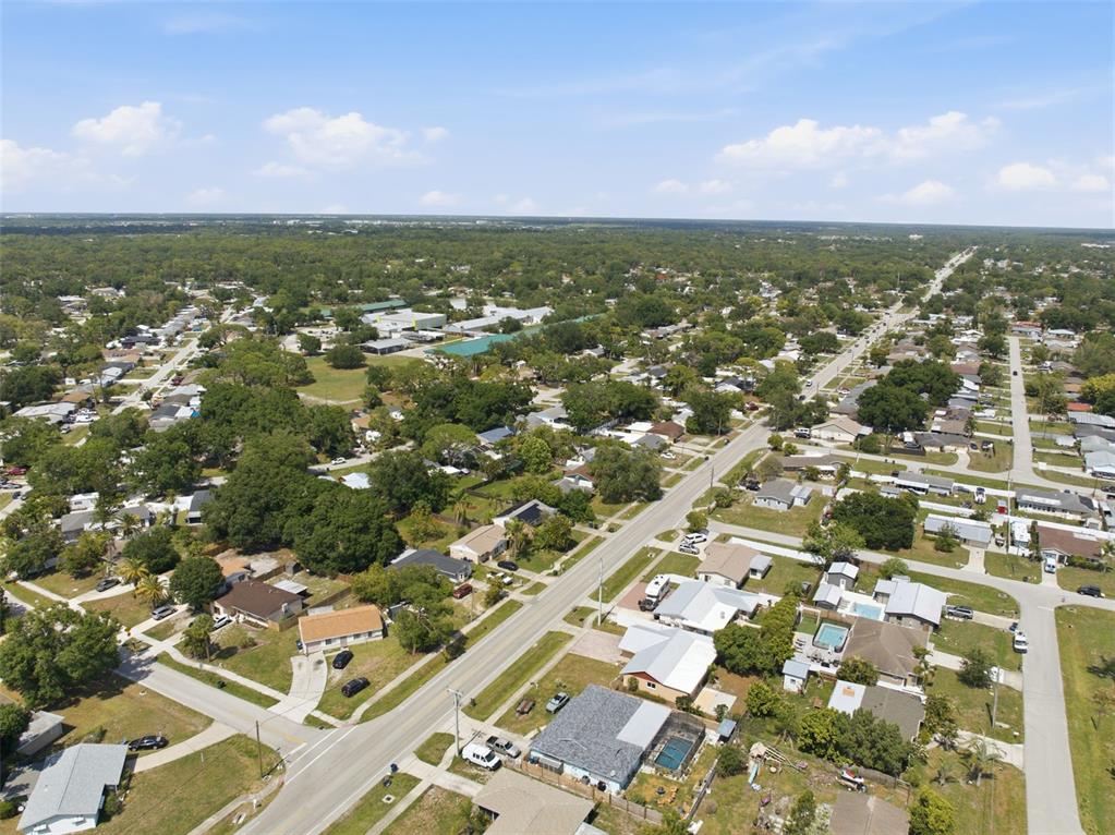 4536 Webber Street Sarasota, FL 34232 - Photo 34 of 45 an aerial view of residential building with parking space