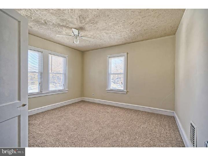 407 North Broadway Pitman, NJ 08071 - Photo 12 of 20 a view of an empty room with a window