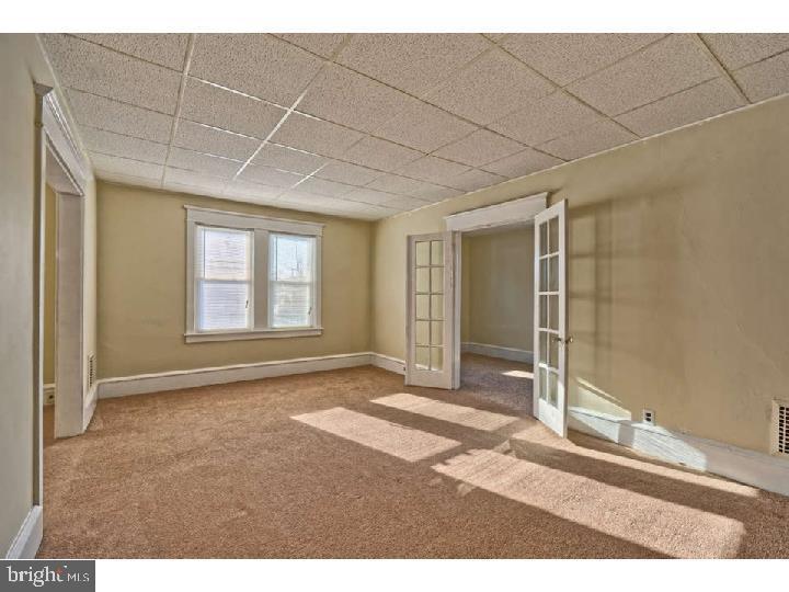 407 North Broadway Pitman, NJ 08071 - Photo 15 of 20 a view of a room with wooden floor and windows
