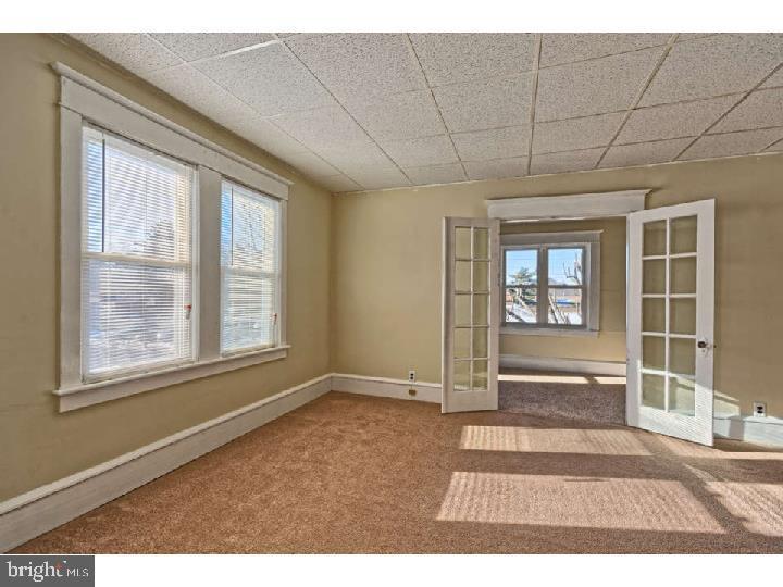 407 North Broadway Pitman, NJ 08071 - Photo 17 of 20 an empty room with windows