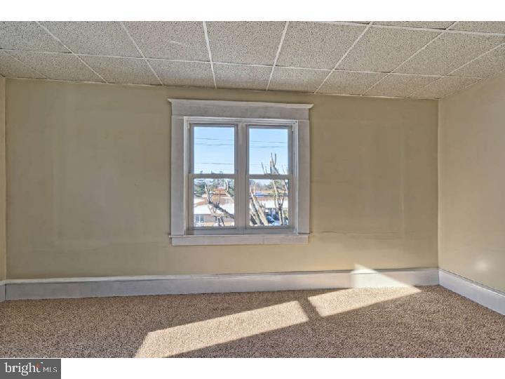407 North Broadway Pitman, NJ 08071 - Photo 18 of 20 a black and white photo of a living room
