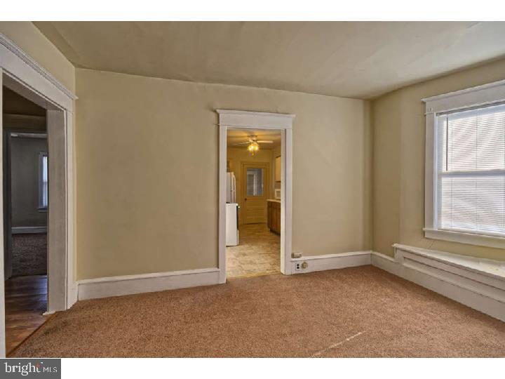 407 North Broadway Pitman, NJ 08071 - Photo 8 of 20 an empty room with windows