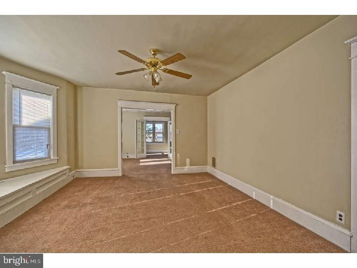 407 North Broadway Pitman, NJ 08071 - Photo 9 of 20 a view of an empty room with a window