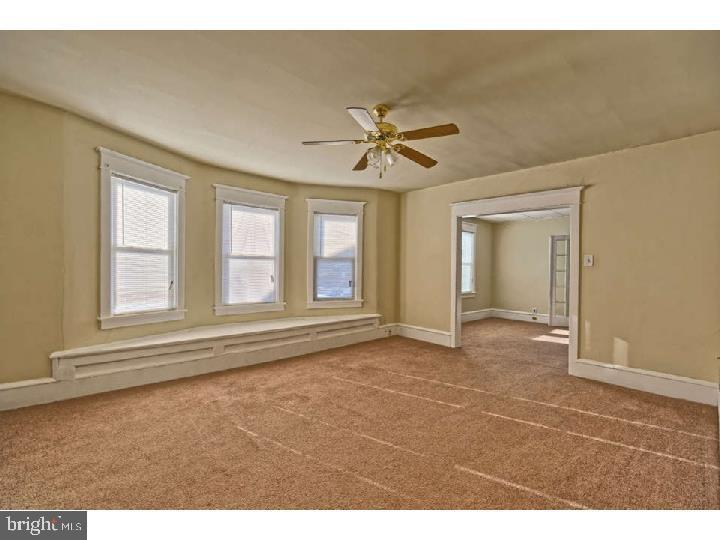 407 North Broadway Pitman, NJ 08071 - Photo 10 of 20 a view of an empty room with a window