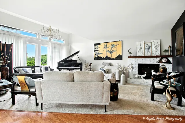 a living room with furniture and a fireplace