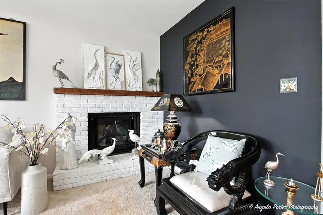 a living room with furniture and a fireplace