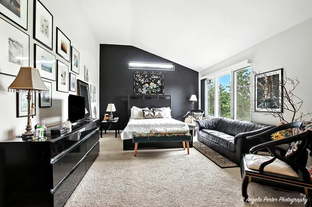 a living room with furniture fireplace and flat screen tv