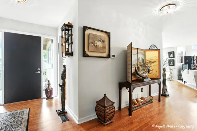 a view of a livingroom with furniture and wooden floor