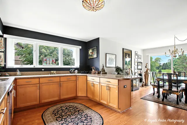 a kitchen with stainless steel appliances granite countertop a stove and a sink