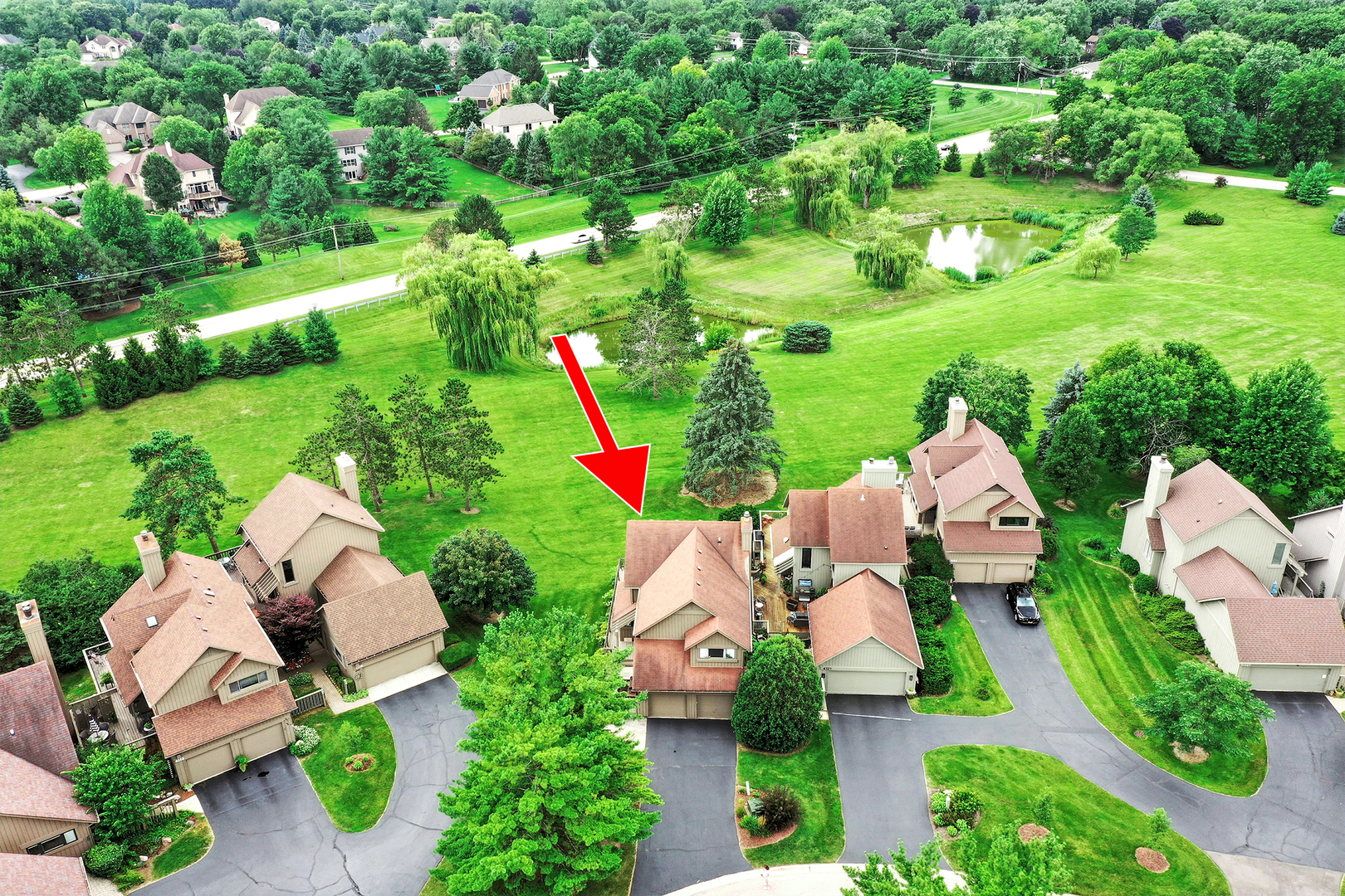 4119 White Ash Road Crystal Lake, IL 60014 - Photo 42 of 48 an aerial view of multiple house houses with swimming pool and outdoor seating