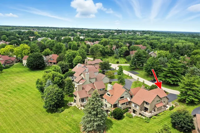 an aerial view of a house with a swimming pool