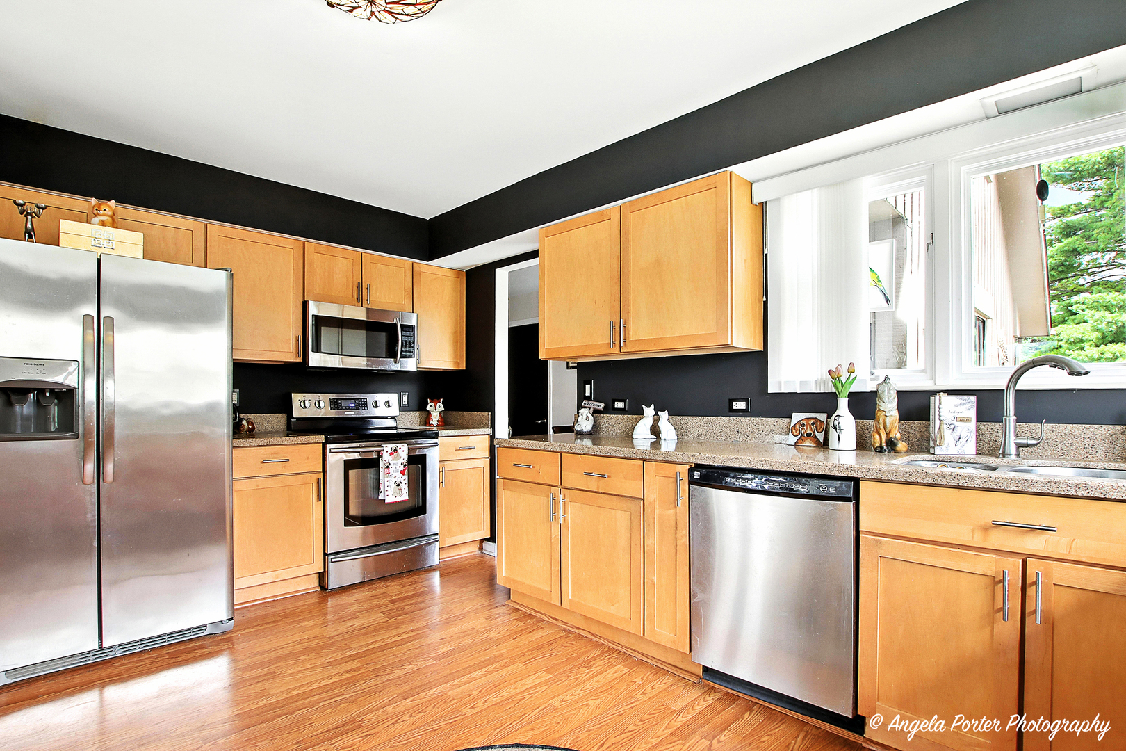 4119 White Ash Road Crystal Lake, IL 60014 - Photo 8 of 48 a kitchen with stainless steel appliances granite countertop a refrigerator a sink dishwasher a stove and white cabinets with wooden floor