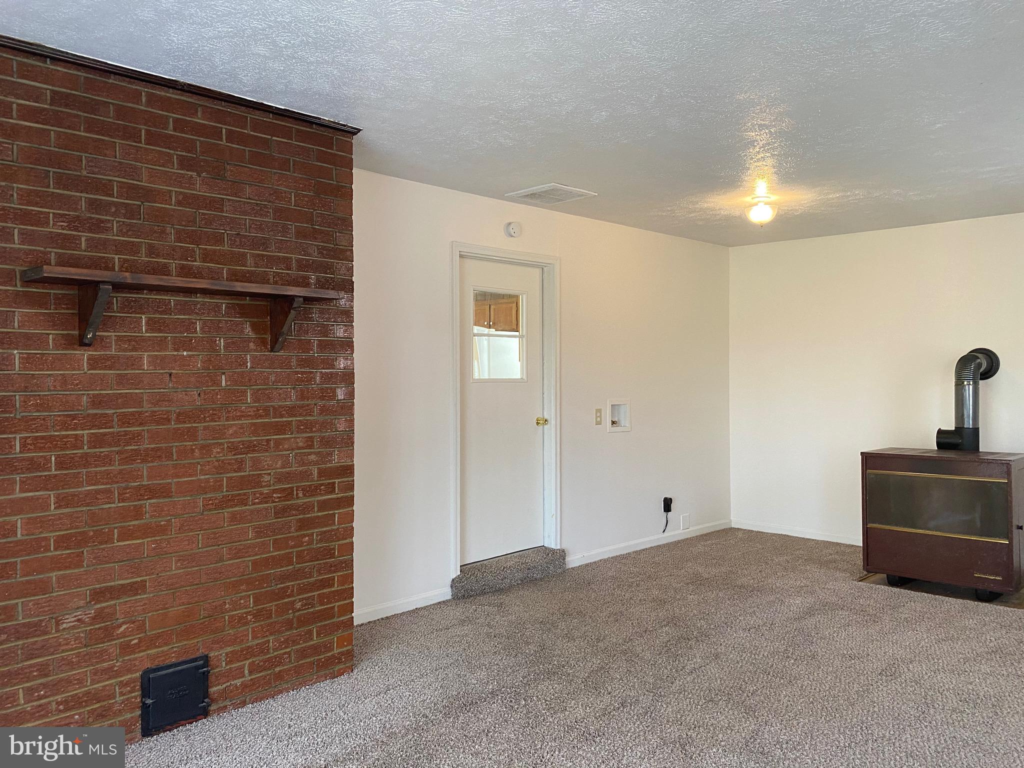 41 Comptons Road Castleton, VA 22716 - Photo 4 of 35 Family room w/separate entrance and cozy stove.