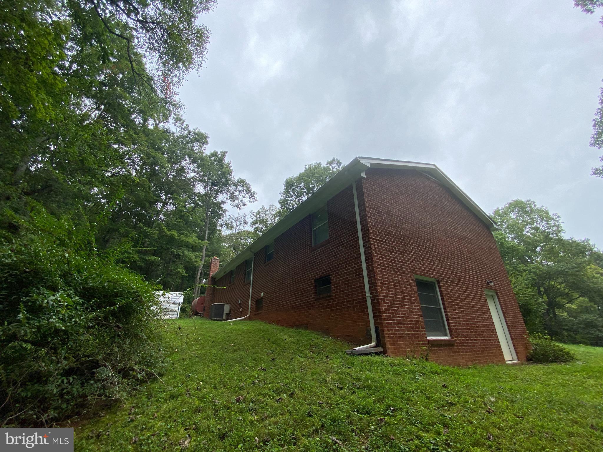 41 Comptons Road Castleton, VA 22716 - Photo 32 of 35 Back of house from the start of woods.
