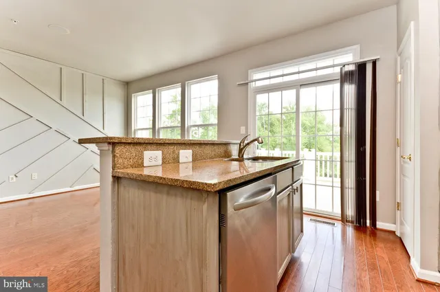 a balcony with wooden floor and fence