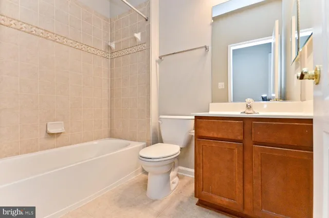 a bathroom with a shower and a bath tub