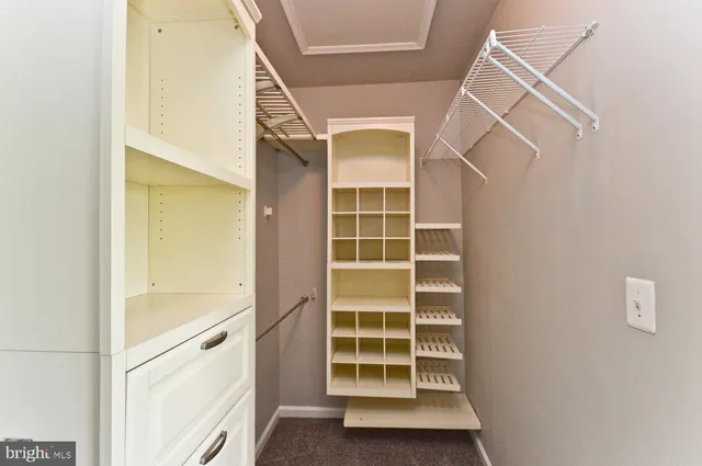 a spacious bathroom with a tub sink and mirror