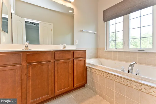 a white bath tub sitting next to a window