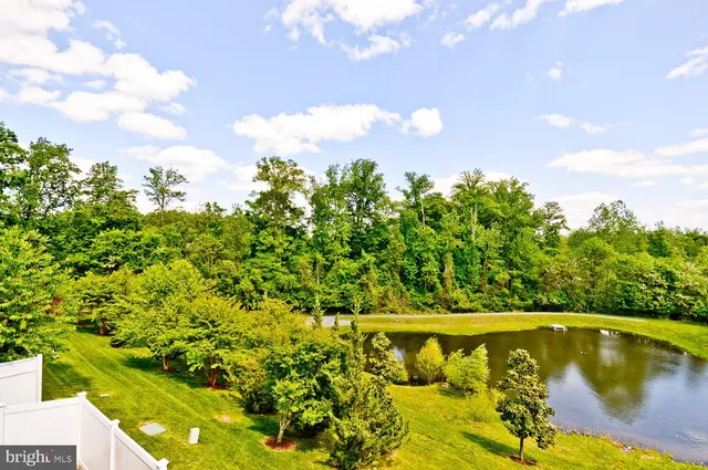 a view of a swimming pool with an outdoor space and seating area