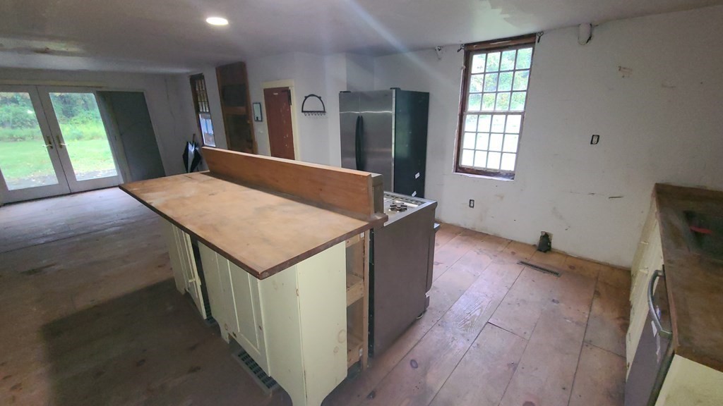 1442 Main Road Granville, MA 01034 - Photo 13 of 27 wooden floor in an empty room with a window
