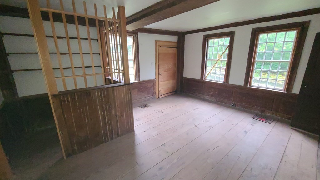 1442 Main Road Granville, MA 01034 - Photo 16 of 27 a view of an empty room with a window