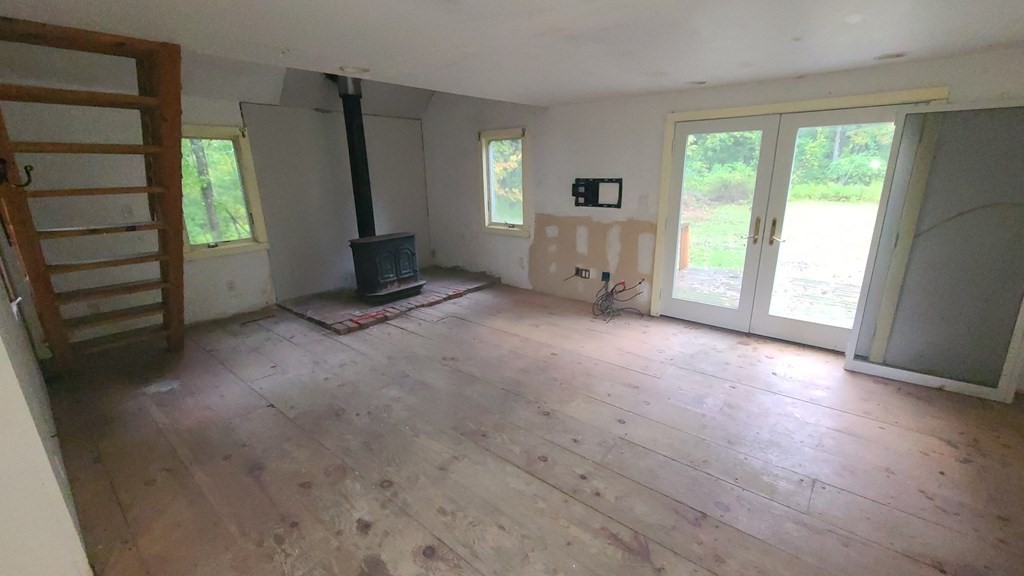 1442 Main Road Granville, MA 01034 - Photo 6 of 27 an empty room with windows