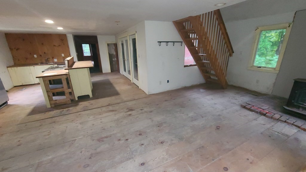 1442 Main Road Granville, MA 01034 - Photo 9 of 27 a view of a livingroom with furniture and staircase