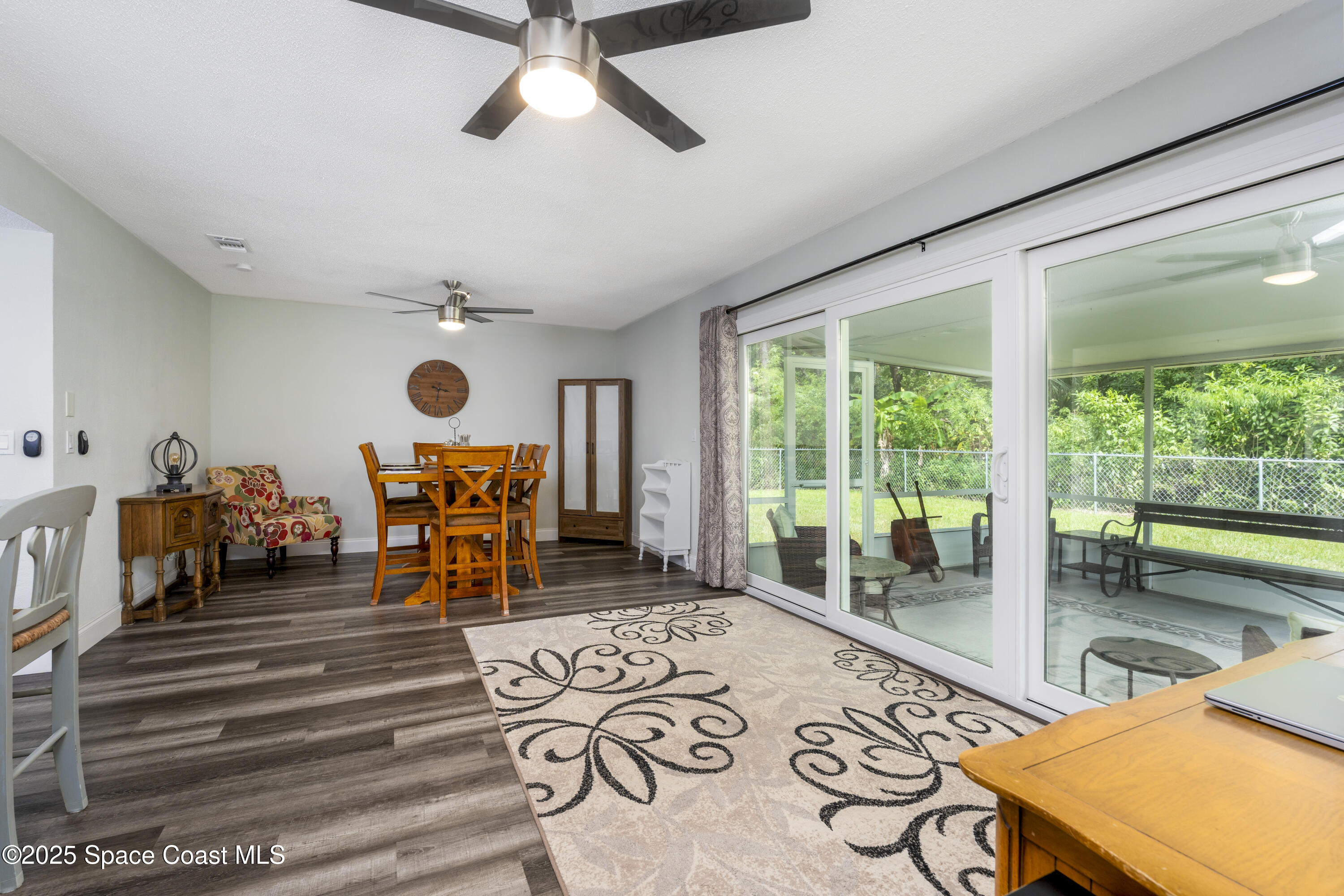 686 Hand Avenue Ormond Beach, FL 32174 - Photo 11 of 29 a living room with furniture and a large window
