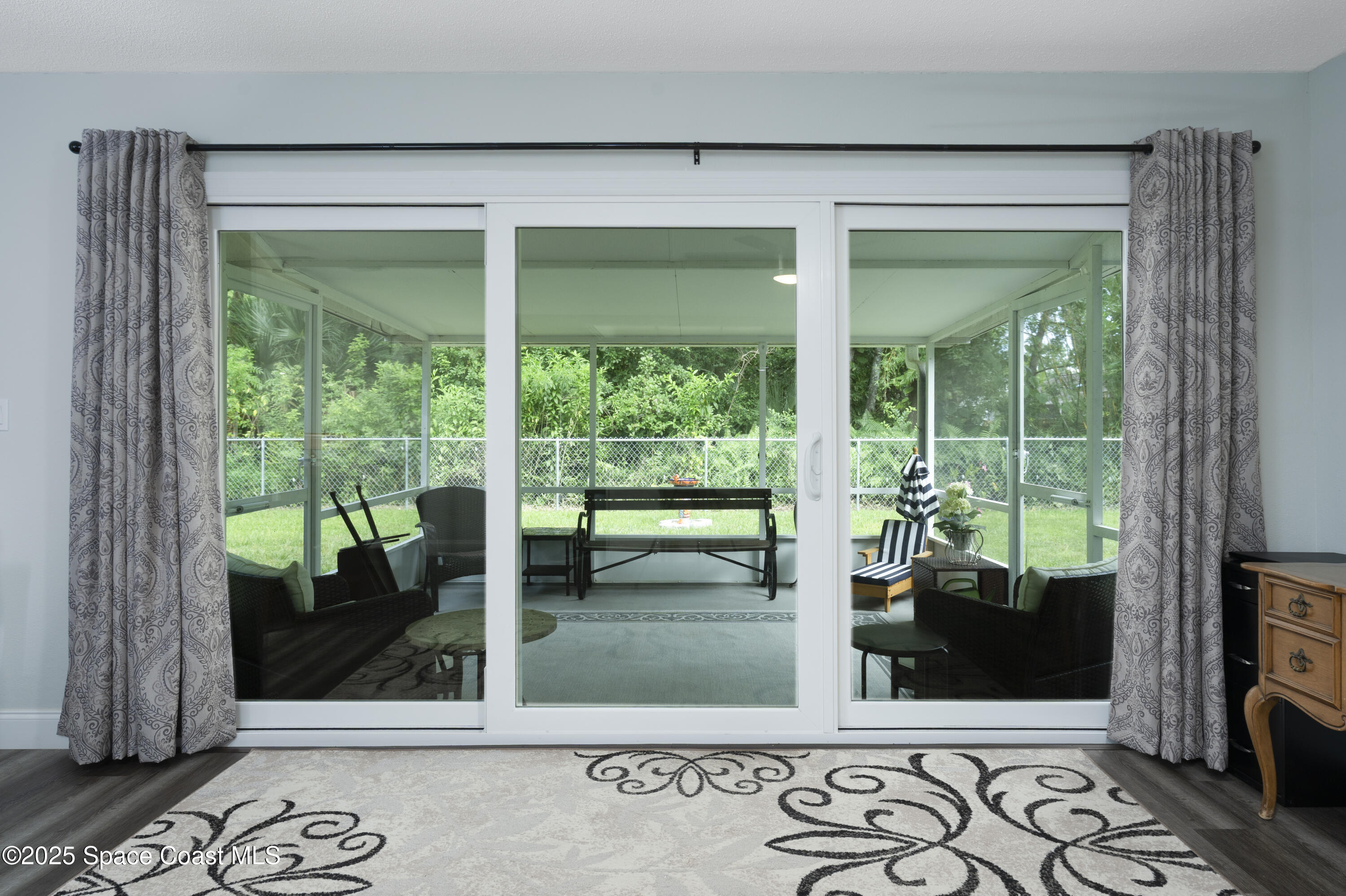 686 Hand Avenue Ormond Beach, FL 32174 - Photo 12 of 29 a living room with glass door
