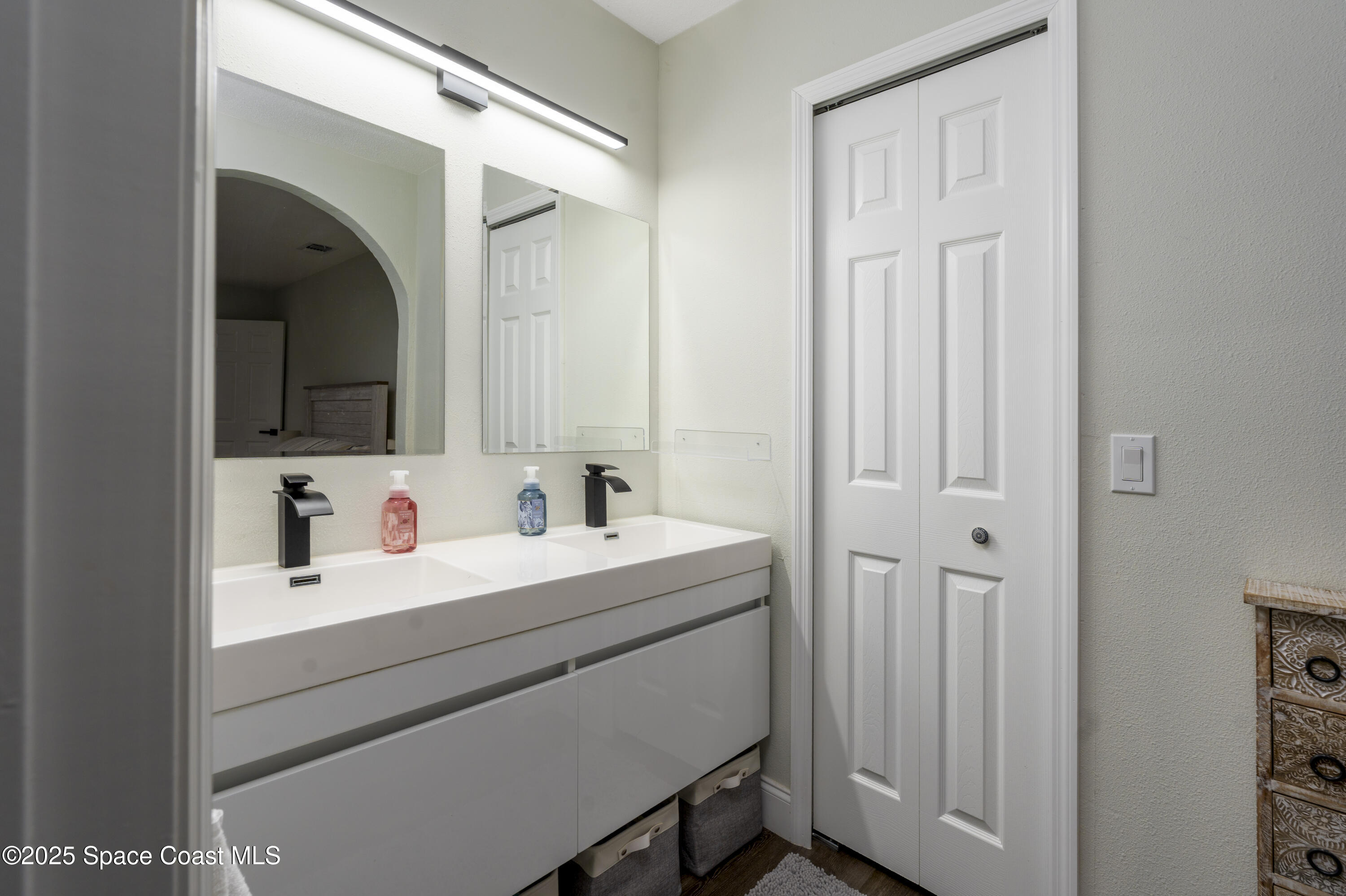 686 Hand Avenue Ormond Beach, FL 32174 - Photo 16 of 29 a bathroom with a sink and a mirror