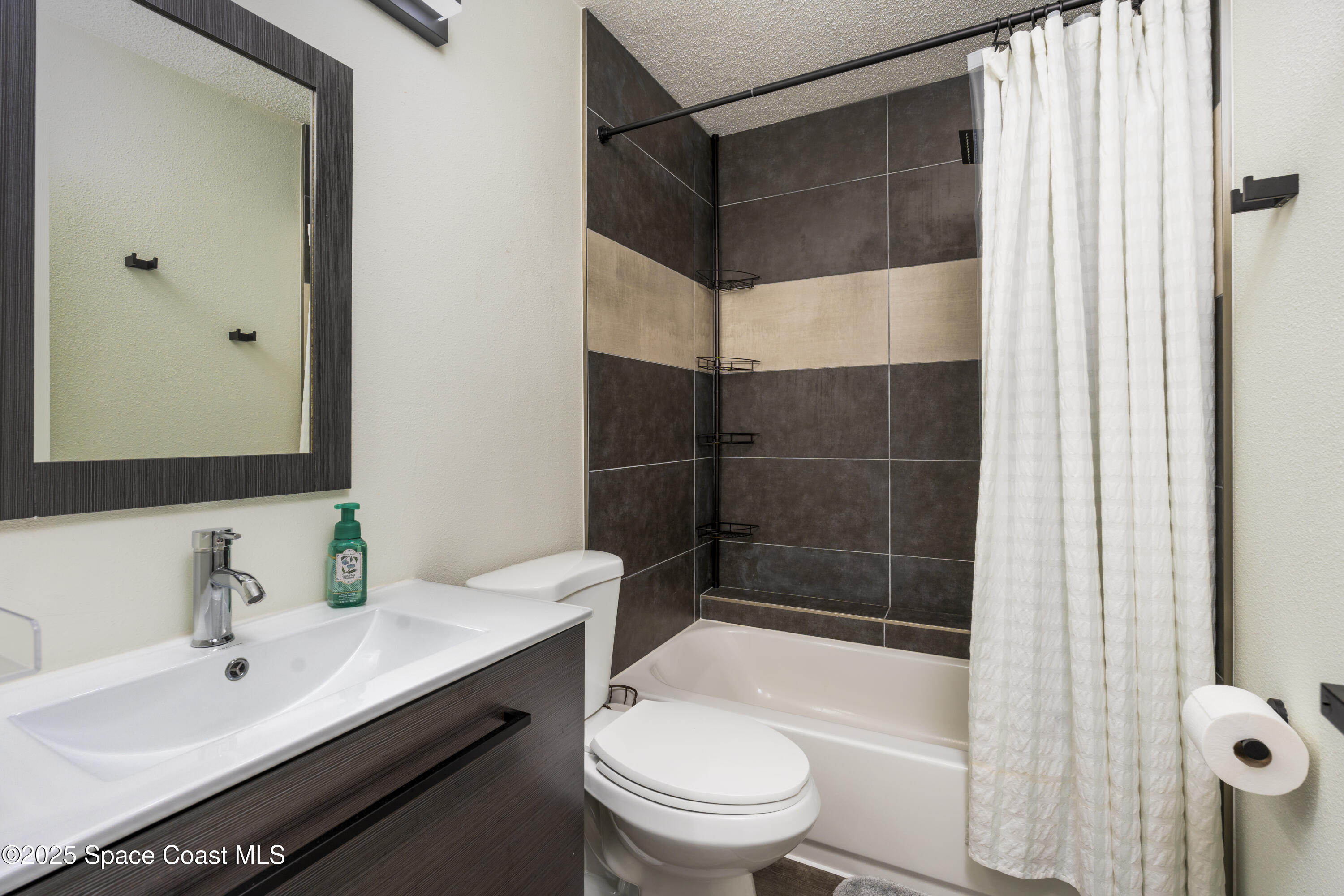 686 Hand Avenue Ormond Beach, FL 32174 - Photo 20 of 29 a bathroom with a sink a toilet and shower