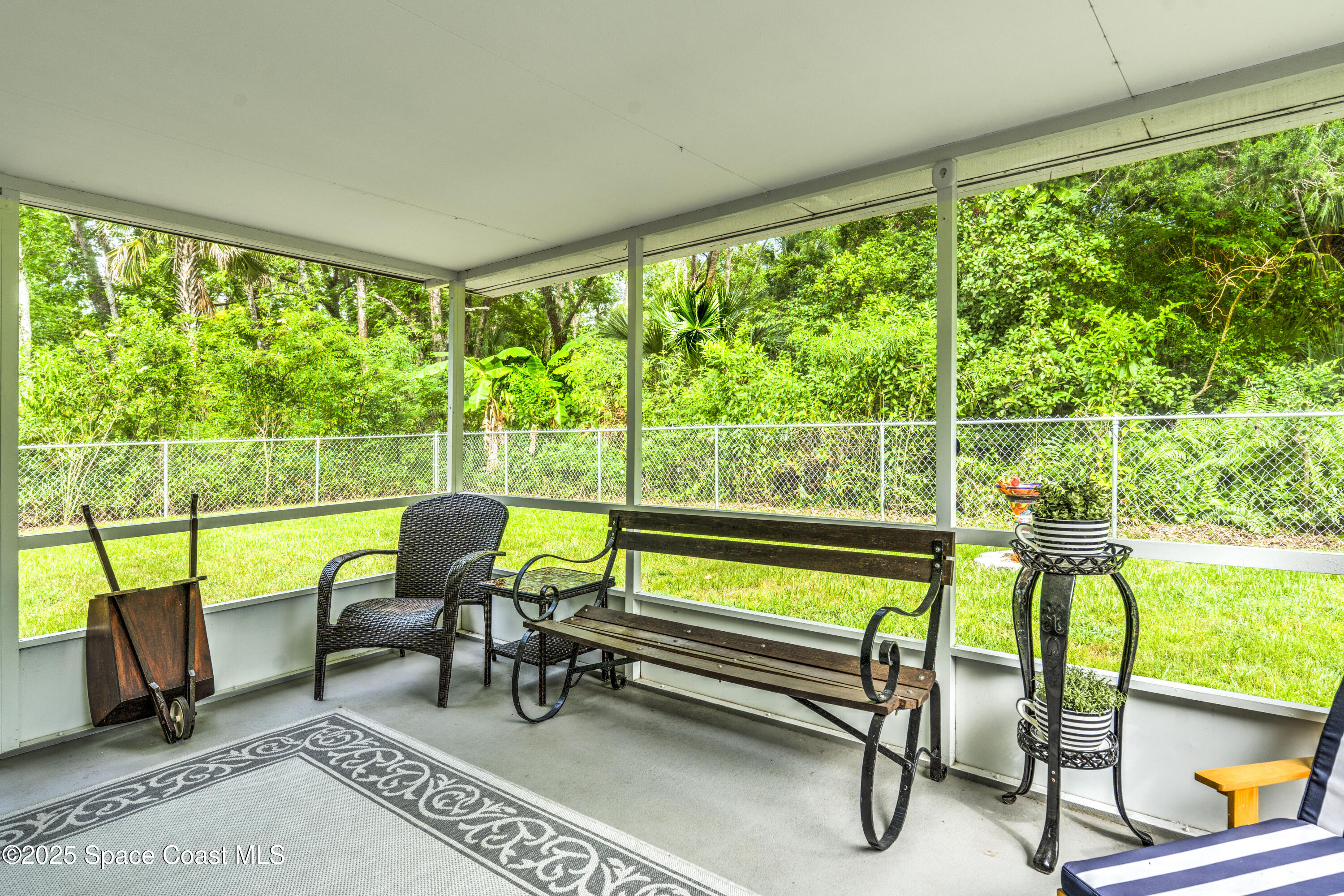 686 Hand Avenue Ormond Beach, FL 32174 - Photo 23 of 29 a view of a chairs and table in the patio