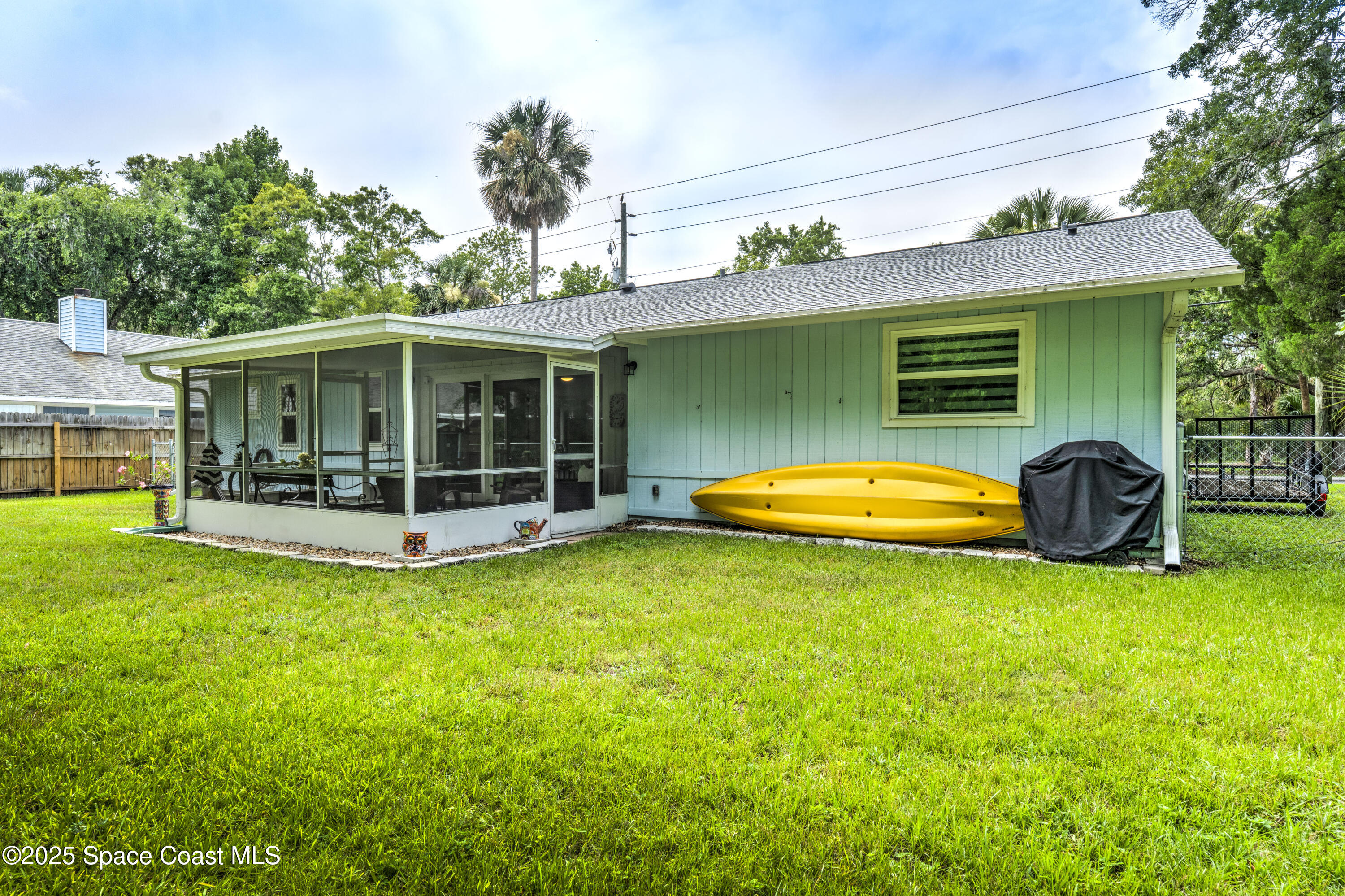 686 Hand Avenue Ormond Beach, FL 32174 - Photo 25 of 29 a view of a house with swimming pool and porch