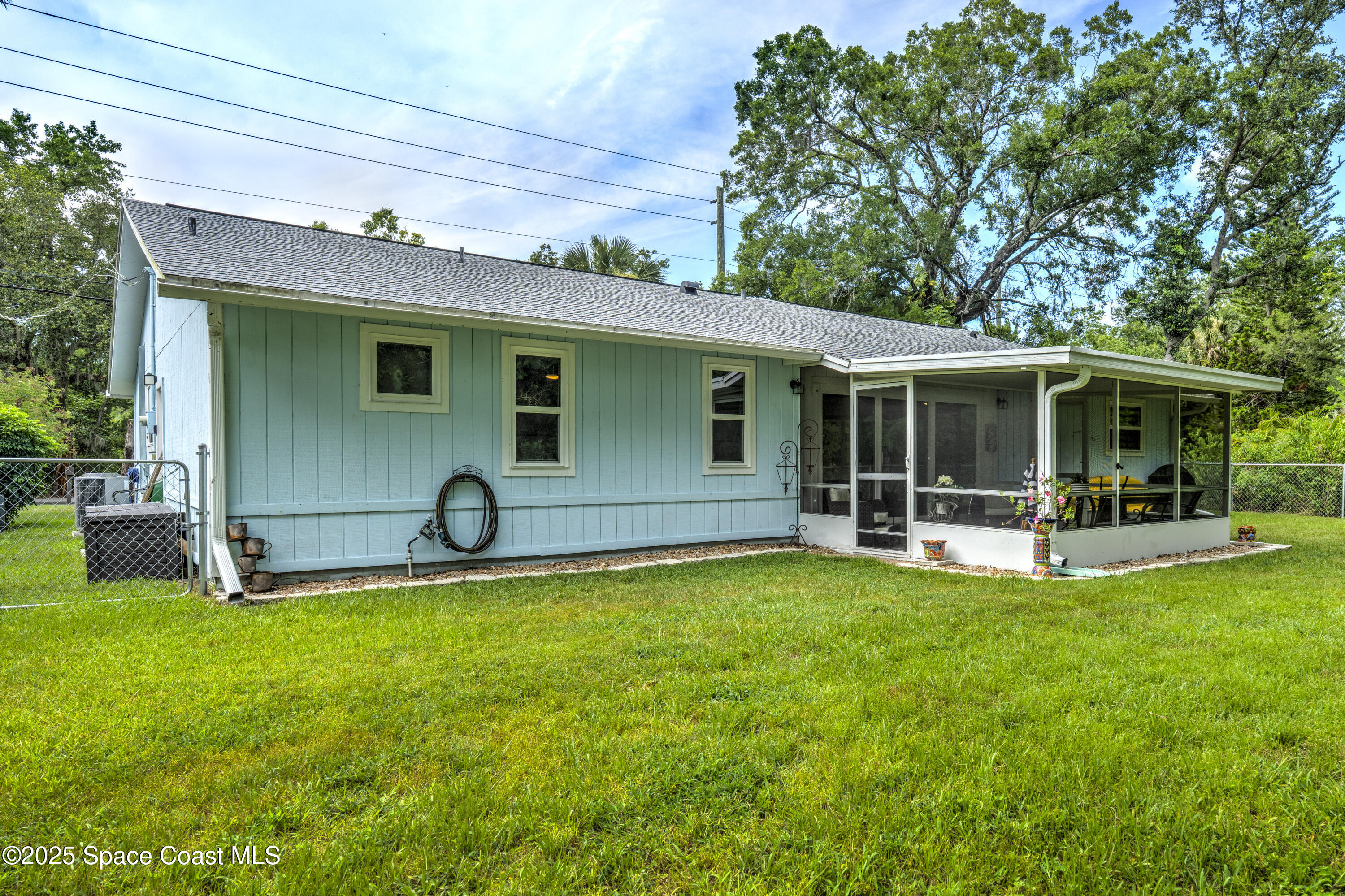 686 Hand Avenue Ormond Beach, FL 32174 - Photo 26 of 29 a view of a house with a backyard porch and sitting area