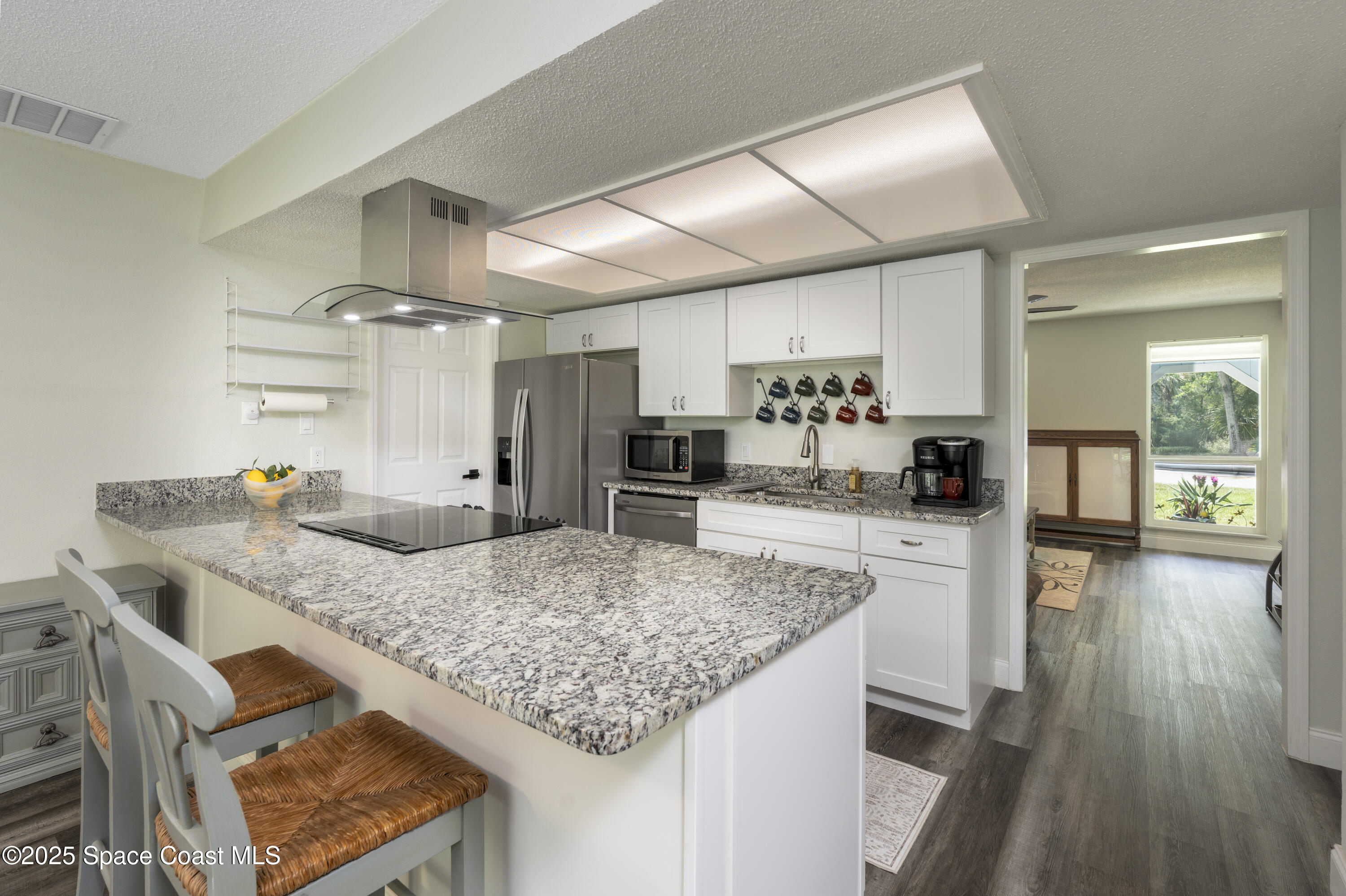 686 Hand Avenue Ormond Beach, FL 32174 - Photo 7 of 29 a kitchen with a table and chairs in it