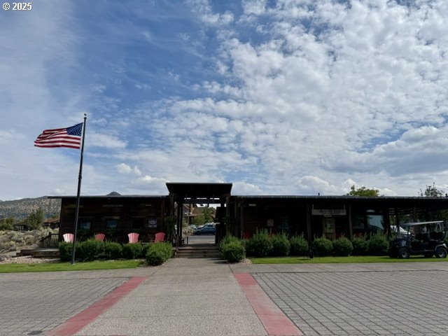 Southwest Mecate Lane, Unit TL330 Powell Butte, OR 97753 - Photo 6 of 10 a front view of a house with a garden