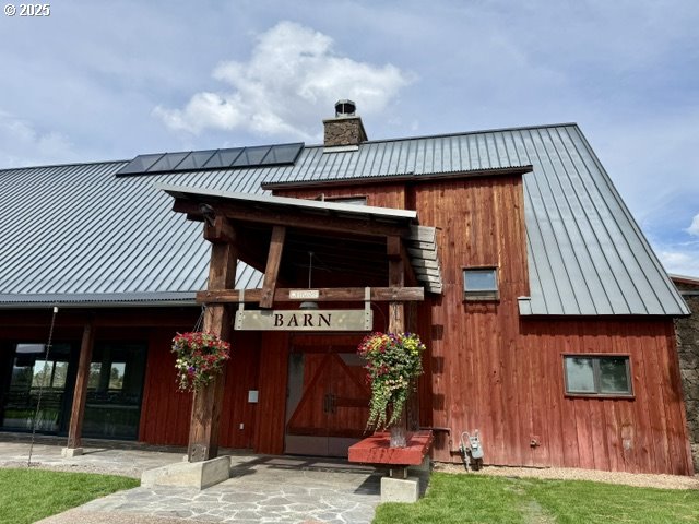 Southwest Mecate Lane, Unit TL330 Powell Butte, OR 97753 - Photo 7 of 10 a front view of a house with garden