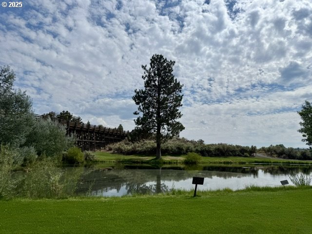 Southwest Mecate Lane, Unit TL330 Powell Butte, OR 97753 - Photo 8 of 10 a view of a lake with a mountain in the background
