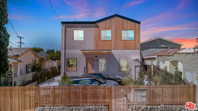 a front view of a house with glass windows
