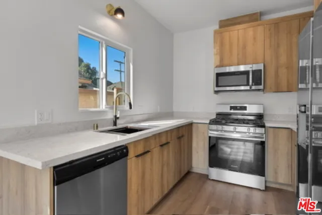 a kitchen with a stove and a sink