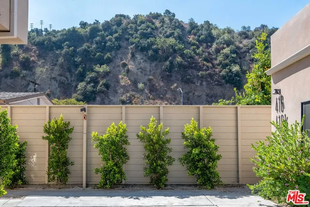a view of street along with plants
